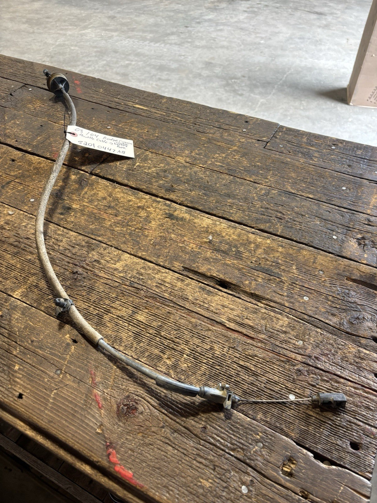 2003 2004 DODGE RAM CUMMINS THROTTLE CABLE TO UNDER BATTERY BOX 52010447AB